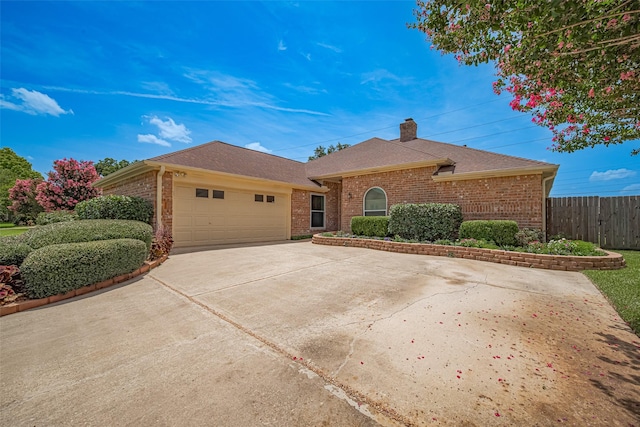 15435 Rio Plaza Dr, Houston, TX 77083 - ranch-style house featuring brick siding, an attached garage, a chimney, driveway, and roof with shingles