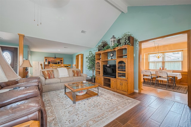 15435 Rio Plaza Dr, Houston, TX 77083 - living area featuring beamed ceiling, wood finished floors, and high vaulted ceiling