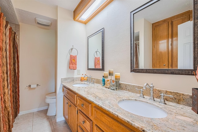 15435 Rio Plaza Dr, Houston, TX 77083 - bathroom featuring double vanity and tile patterned flooring