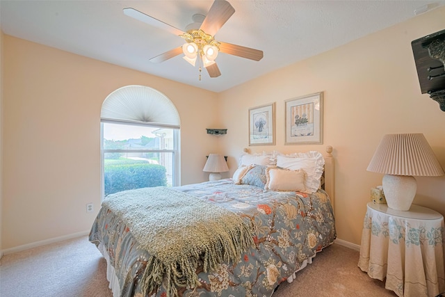 15435 Rio Plaza Dr, Houston, TX 77083 - carpeted bedroom with baseboards and a ceiling fan