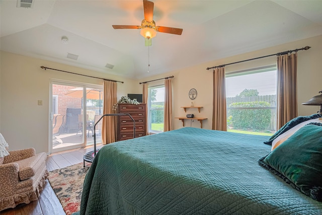 15435 Rio Plaza Dr, Houston, TX 77083 - bedroom with access to exterior, vaulted ceiling, wood finished floors, and ceiling fan