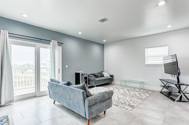 4018 6th St, Galveston, TX 77554 - living room featuring recessed lighting and light tile patterned floors