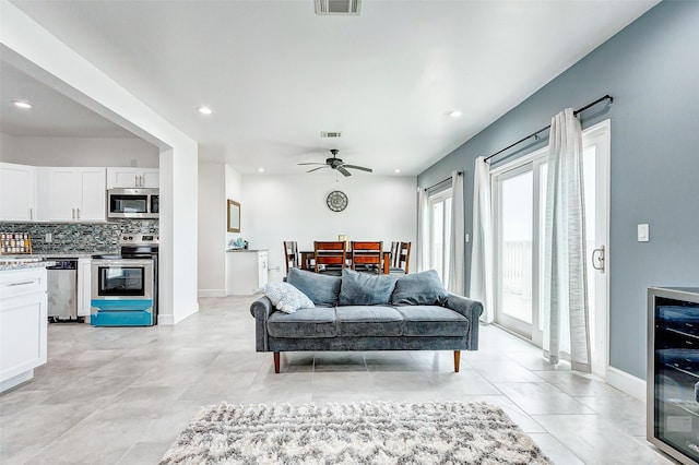4018 6th St, Galveston, TX 77554 - living area with beverage cooler, ceiling fan, and recessed lighting
