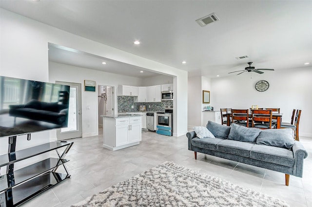 4018 6th St, Galveston, TX 77554 - living room with recessed lighting, a ceiling fan, and light tile patterned floors