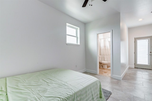 4018 6th St, Galveston, TX 77554 - bedroom featuring ensuite bathroom, light tile patterned flooring, and ceiling fan