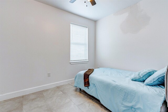 4018 6th St, Galveston, TX 77554 - bedroom featuring a ceiling fan and light tile patterned floors
