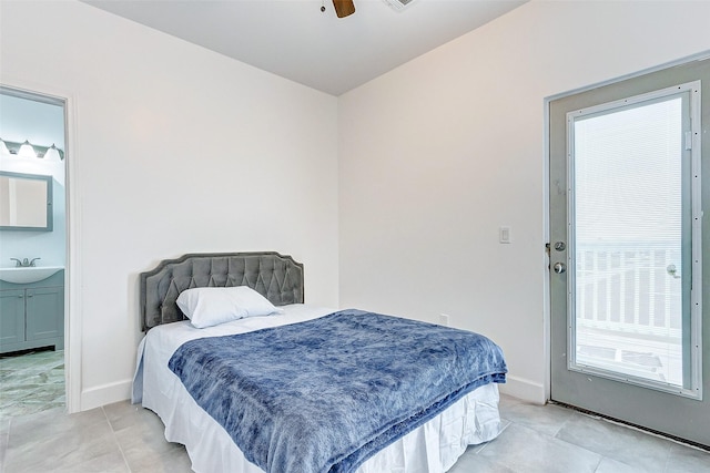 4018 6th St, Galveston, TX 77554 - bedroom featuring light tile patterned flooring, connected bathroom, and a ceiling fan