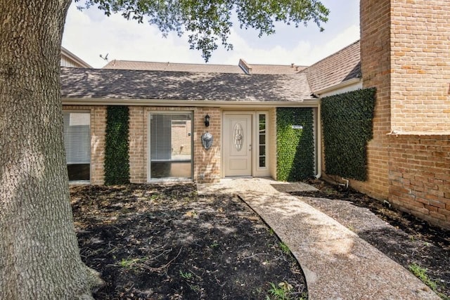 4710 N Cashel Cir, Houston, TX 77069 - doorway to property with roof with shingles and brick siding