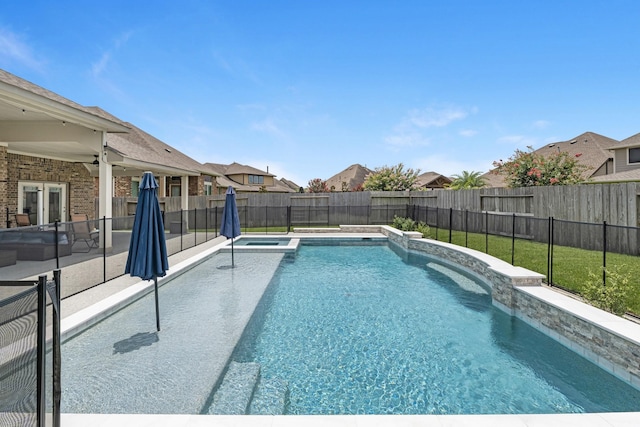 15519 Ponderosa Bend Dr, Cypress, TX 77429 - view of pool featuring a fenced backyard, a patio, a pool with connected hot tub, and a residential view