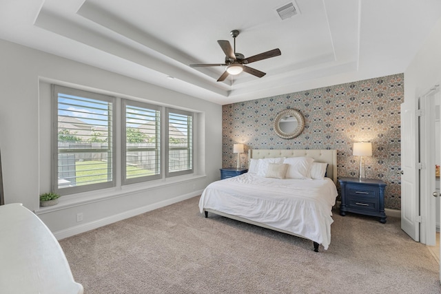 15519 Ponderosa Bend Dr, Cypress, TX 77429 - bedroom featuring a tray ceiling, light colored carpet, and ceiling fan