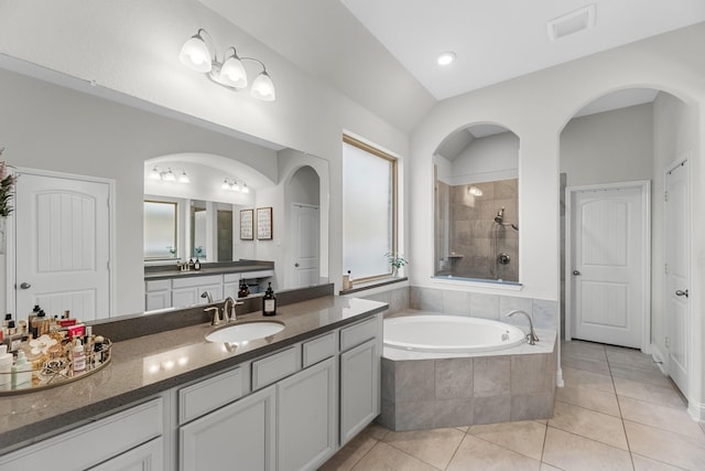 15519 Ponderosa Bend Dr, Cypress, TX 77429 - bathroom with tile patterned flooring, a bath, vanity, and a tile shower