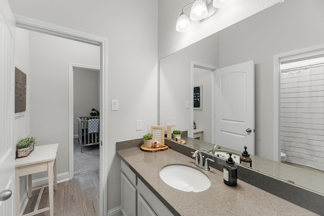 15519 Ponderosa Bend Dr, Cypress, TX 77429 - bathroom featuring vanity and wood finished floors