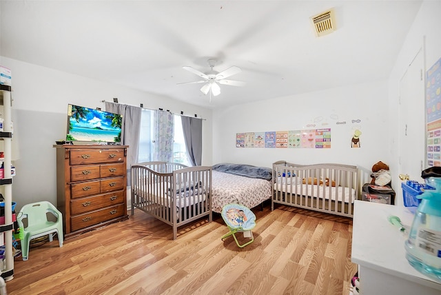 4014 Timber Cor, Houston, TX 77082 - bedroom with light wood-style floors and ceiling fan