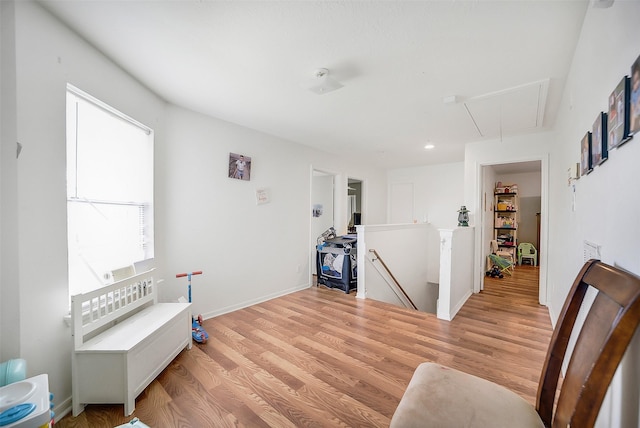 4014 Timber Cor, Houston, TX 77082 - sitting room with attic access, an upstairs landing, and light wood-type flooring