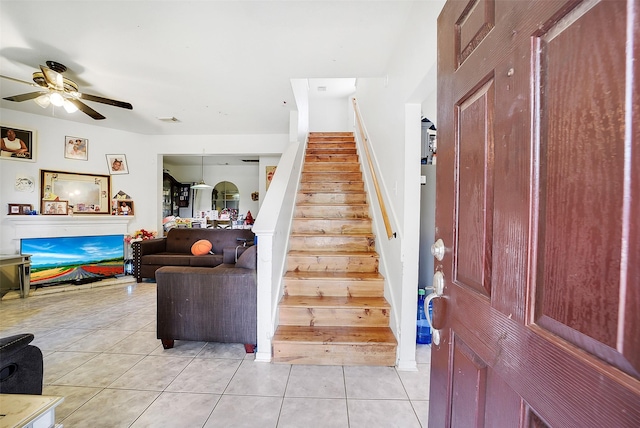 4014 Timber Cor, Houston, TX 77082 - foyer with light tile patterned flooring, stairs, and a ceiling fan