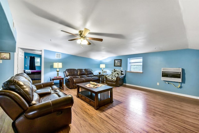 19757 Dorris Dr, Magnolia, TX 77355 - living area with heating unit, lofted ceiling, a ceiling fan, and wood finished floors