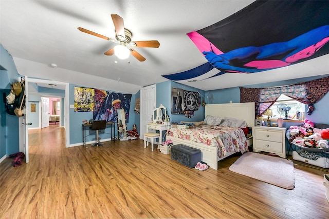 19757 Dorris Dr, Magnolia, TX 77355 - bedroom with wood finished floors and a ceiling fan