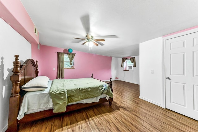 19757 Dorris Dr, Magnolia, TX 77355 - bedroom with wood finished floors and a ceiling fan