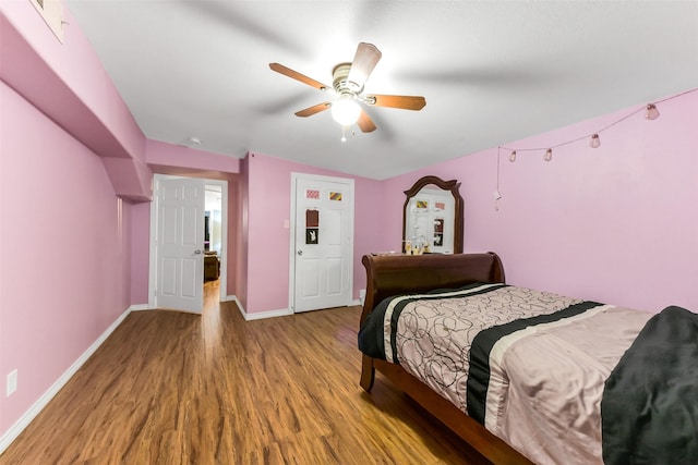 19757 Dorris Dr, Magnolia, TX 77355 - bedroom with wood finished floors and ceiling fan