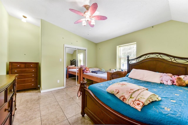 19757 Dorris Dr, Magnolia, TX 77355 - bedroom featuring vaulted ceiling, ceiling fan, light tile patterned floors, and a closet
