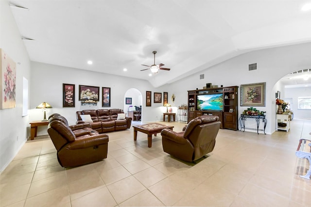 19757 Dorris Dr, Magnolia, TX 77355 - living room featuring arched walkways, vaulted ceiling, a ceiling fan, light tile patterned floors, and recessed lighting