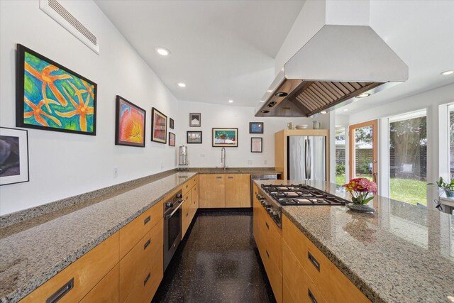 1306 Harbor Vw, Galveston, TX 77551 - kitchen with exhaust hood, stainless steel appliances, light stone countertops, recessed lighting, and light brown cabinetry