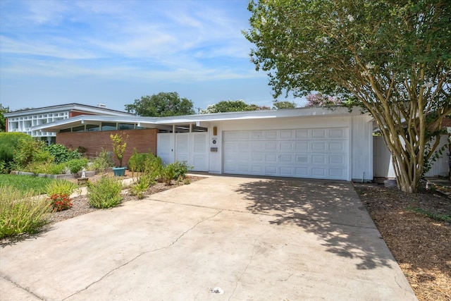 1306 Harbor Vw, Galveston, TX 77551 - view of front of house featuring concrete driveway and an attached garage