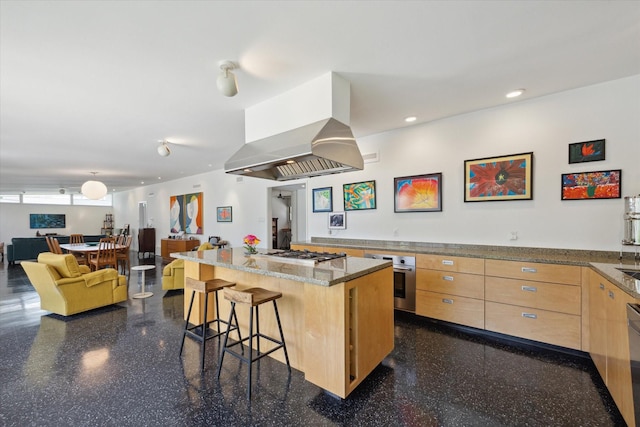 1306 Harbor Vw, Galveston, TX 77551 - kitchen with appliances with stainless steel finishes, light brown cabinets, island range hood, a breakfast bar area, and light stone countertops