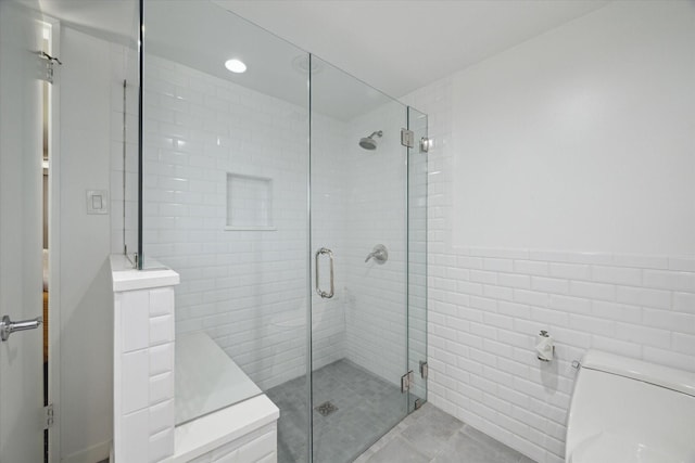 1306 Harbor Vw, Galveston, TX 77551 - full bathroom with a stall shower, tile walls, and tile patterned flooring