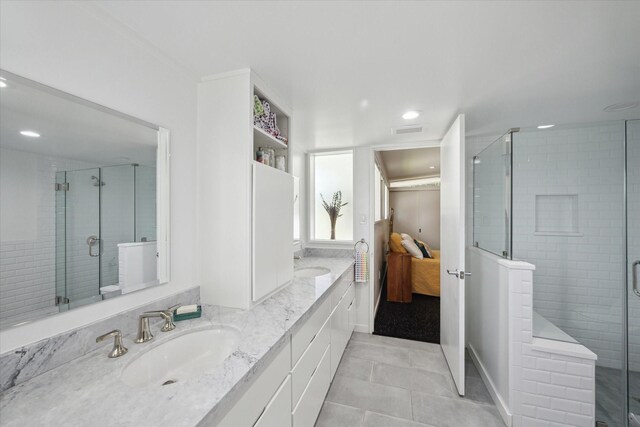 1306 Harbor Vw, Galveston, TX 77551 - ensuite bathroom featuring double vanity, a shower stall, recessed lighting, and tile patterned floors