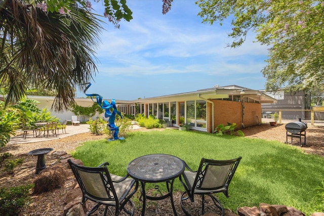 1306 Harbor Vw, Galveston, TX 77551 - view of yard with a sunroom and a patio area