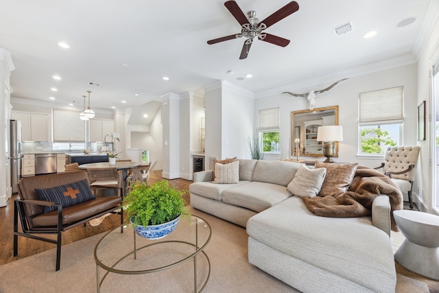 1010 W 24th St Unit N, Houston, TX 77008 - living area with light wood finished floors, recessed lighting, a ceiling fan, and crown molding