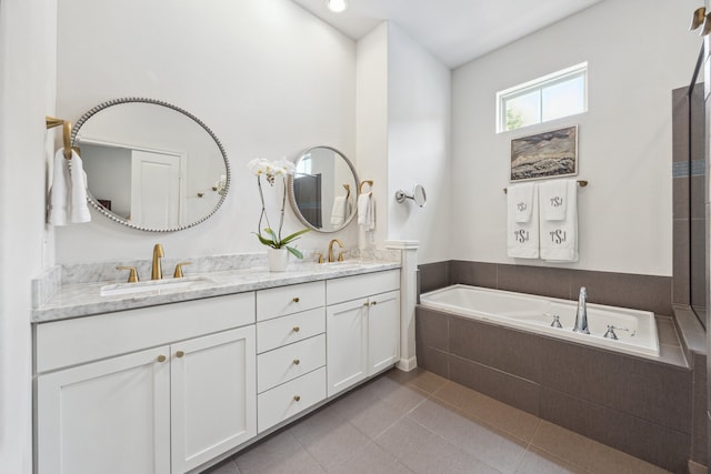 1010 W 24th St Unit N, Houston, TX 77008 - full bathroom featuring double vanity, a bath, and tile patterned flooring