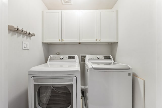 1010 W 24th St Unit N, Houston, TX 77008 - laundry room featuring washer and dryer and cabinet space