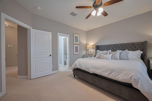 18315 Cape Lookout Way, Humble, TX 77346 - bedroom with light colored carpet, ensuite bath, and a ceiling fan