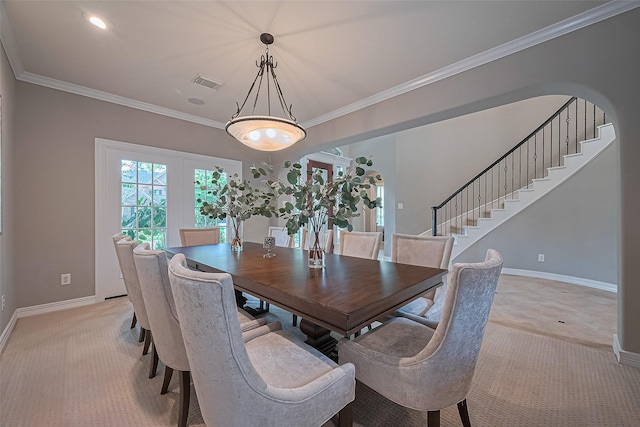 18315 Cape Lookout Way, Humble, TX 77346 - dining space featuring light carpet, ornamental molding, and stairs