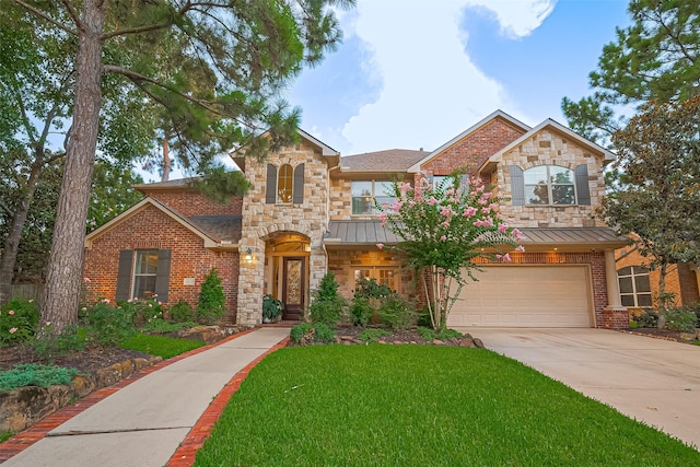 18315 Cape Lookout Way, Humble, TX 77346 - view of front of house with a standing seam roof, an attached garage, concrete driveway, and a front yard