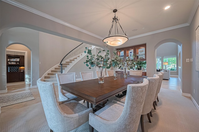 18315 Cape Lookout Way, Humble, TX 77346 - dining area featuring arched walkways, stairway, and ornamental molding