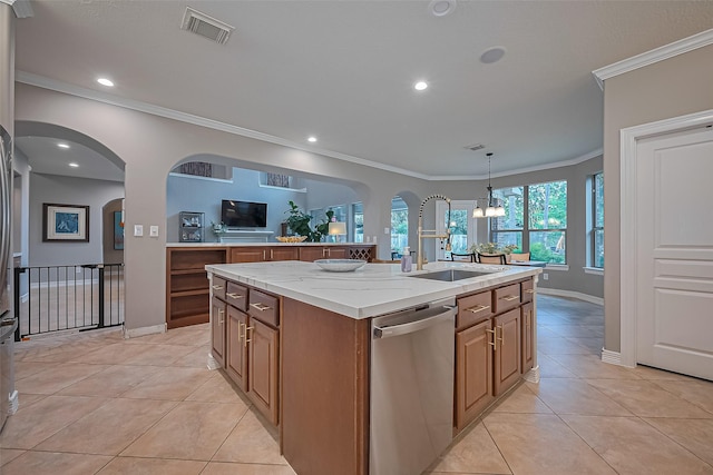 18315 Cape Lookout Way, Humble, TX 77346 - kitchen featuring stainless steel dishwasher, a kitchen island with sink, ornamental molding, arched walkways, and light tile patterned floors