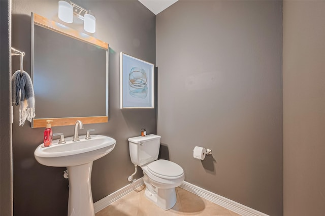 18315 Cape Lookout Way, Humble, TX 77346 - half bathroom with baseboards and tile patterned flooring