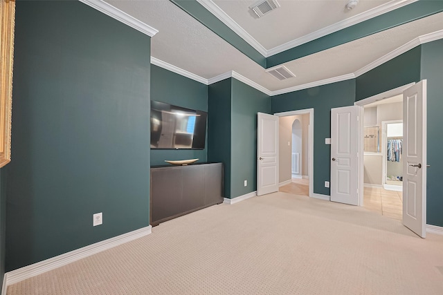 18315 Cape Lookout Way, Humble, TX 77346 - unfurnished bedroom featuring carpet, crown molding, and arched walkways
