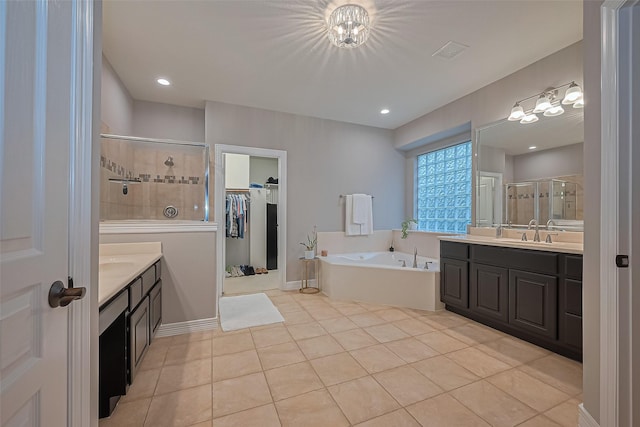18315 Cape Lookout Way, Humble, TX 77346 - full bath with a shower stall, two vanities, a bath, and tile patterned flooring