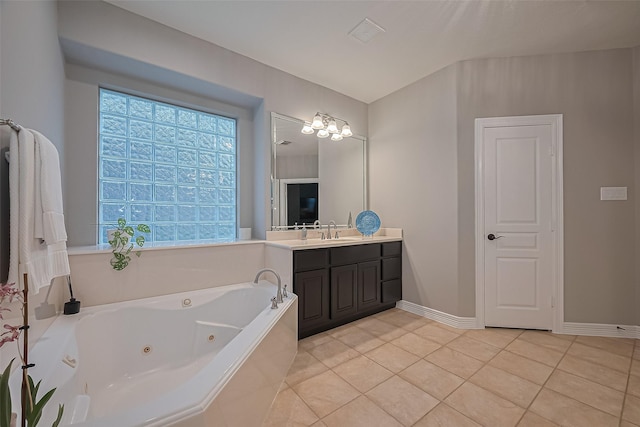 18315 Cape Lookout Way, Humble, TX 77346 - full bathroom featuring vanity, a jetted tub, and tile patterned flooring
