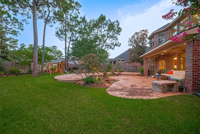 18315 Cape Lookout Way, Humble, TX 77346 - fenced backyard with a patio area, a playground, and a ceiling fan