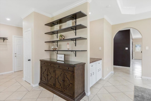 5343 Oak Cove Dr, Houston, TX 77091 - hallway featuring arched walkways, light tile patterned floors, crown molding, and recessed lighting