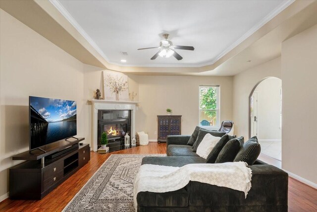 5343 Oak Cove Dr, Houston, TX 77091 - living room with a raised ceiling, a ceiling fan, wood finished floors, and crown molding