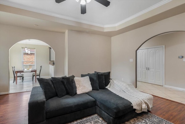 5343 Oak Cove Dr, Houston, TX 77091 - living area featuring arched walkways, a ceiling fan, wood finished floors, and ornamental molding
