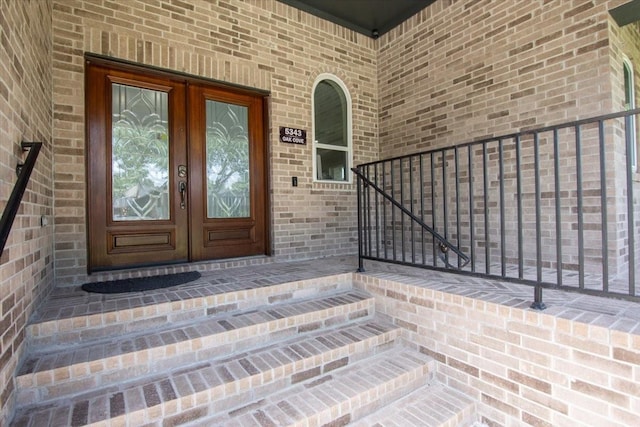5343 Oak Cove Dr, Houston, TX 77091 - doorway to property featuring french doors and brick siding