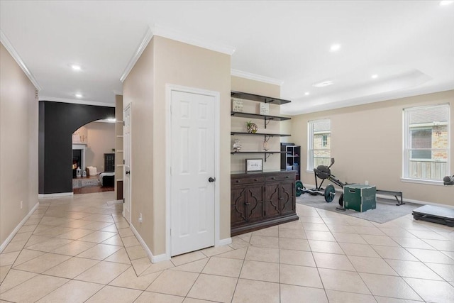 5343 Oak Cove Dr, Houston, TX 77091 - hall featuring arched walkways, crown molding, light tile patterned floors, and recessed lighting