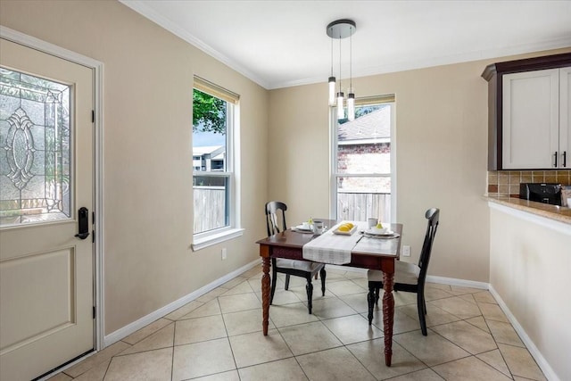 5343 Oak Cove Dr, Houston, TX 77091 - dining space with crown molding and light tile patterned flooring